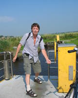 Sebius operating a cable ferry, near where he was born in The Netherlands, August 2005.