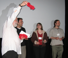 Jim Yorke (University of Maryland) with red sock award winners Daniele Avitabile (University of Surrey), Alethea Barbaro (UC Santa Barbara) and Marshall Hampton (University of Minnesota, Duluth); photograph by Hinke Osinga