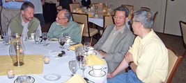 Freddie Dumortier (Hasselt), Jorge Sotomayor (São Paolo), Charles Li (Missouri), and Xiao-Biao Lin (NC State) at the conference dinner