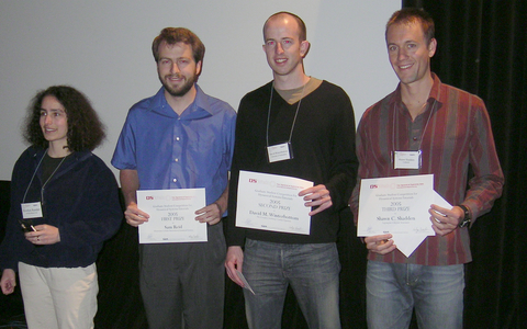 Tutorials Section Chief Editor Evelyn Sander and contest winners Sam Reid, David Winterbottom, and Shawn Shadden at the awards ceremony at the SIAM Dynamical Systems Meeting in Snowbird, Utah. Photo by Bernd Krauskopf.